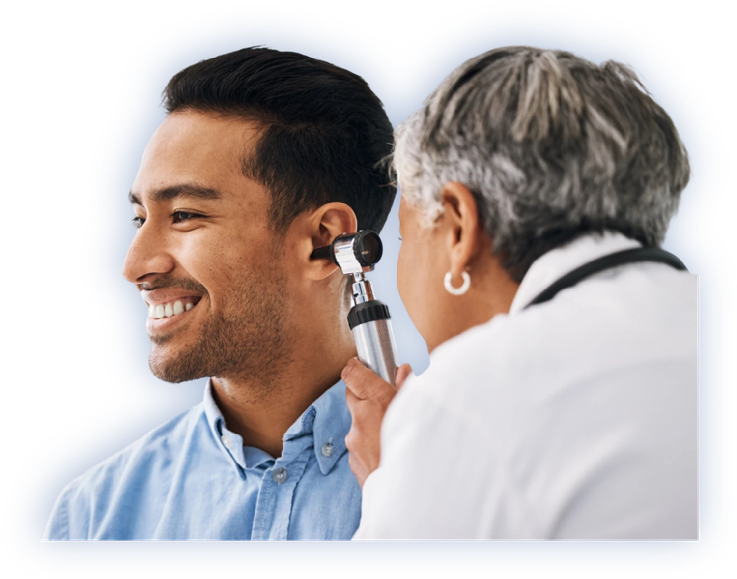 A physician examining a patient's ear with an otoscope