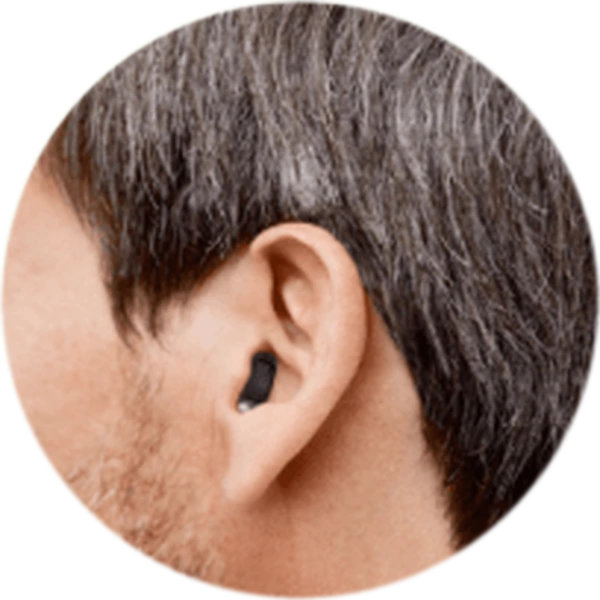 A completely-in-canal hearing device worn in an ear